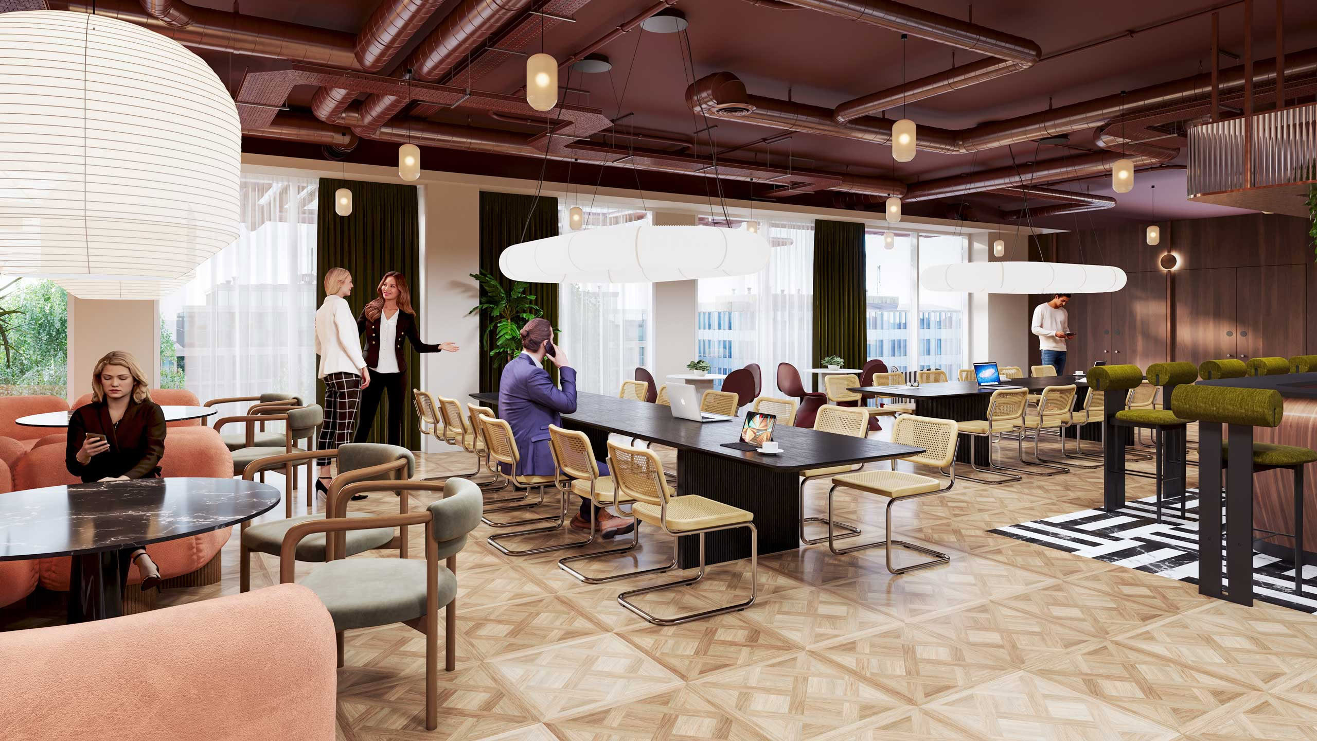 The modern office lounge, nestled within a business park, features people seated and conversing